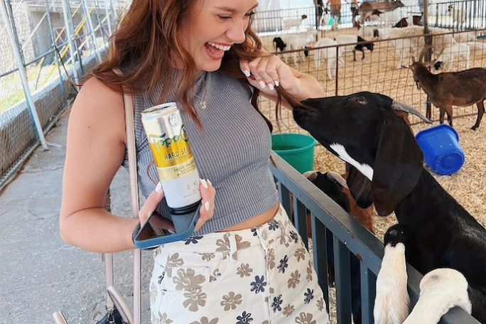 a woman petting a dog